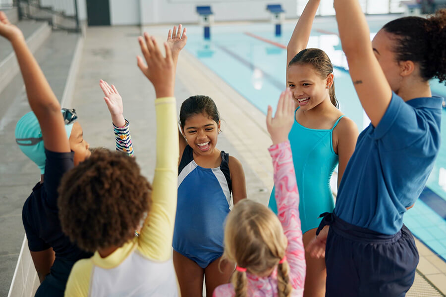 swim team cheering for teammates
