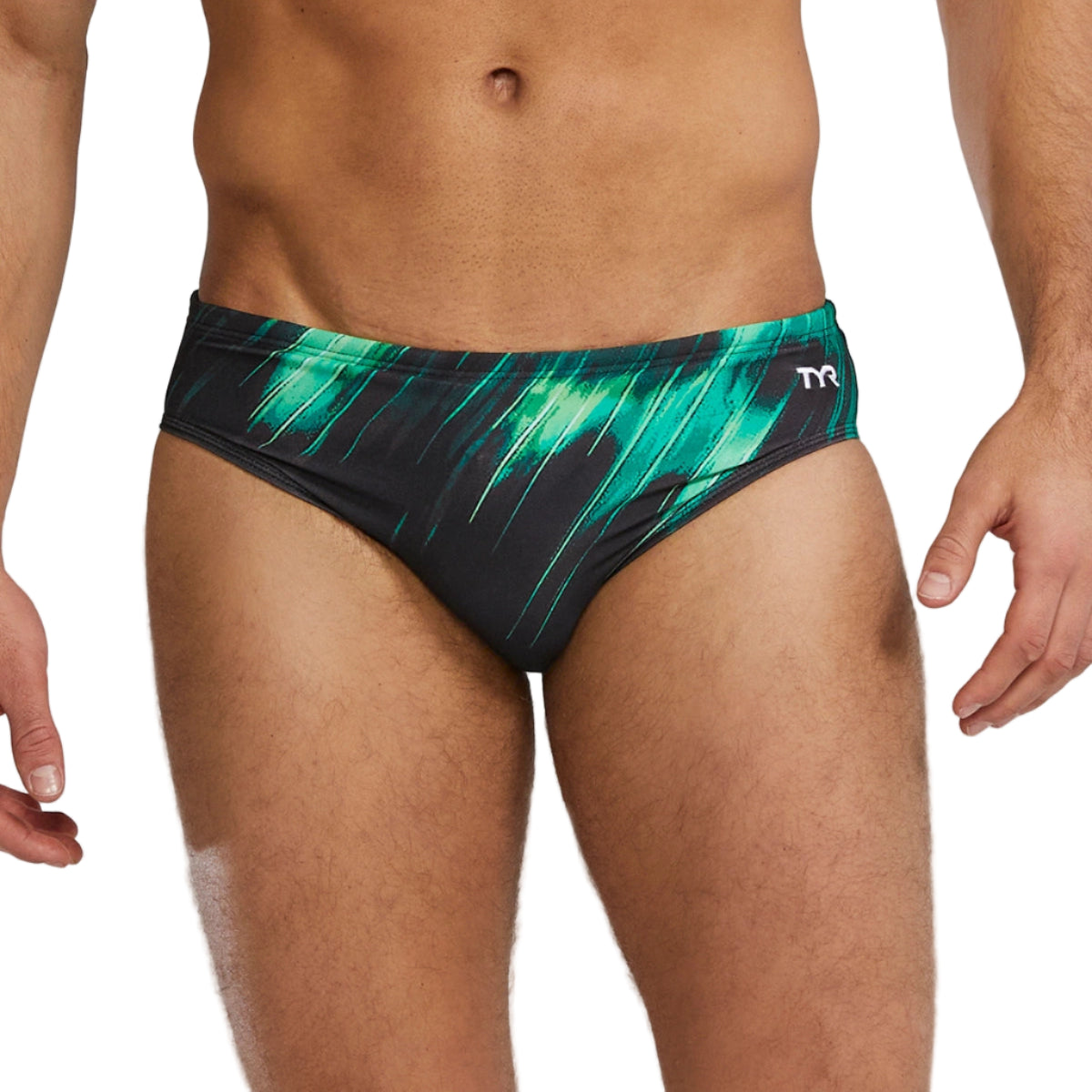 Green and black patterned men's swim briefs on a gray background