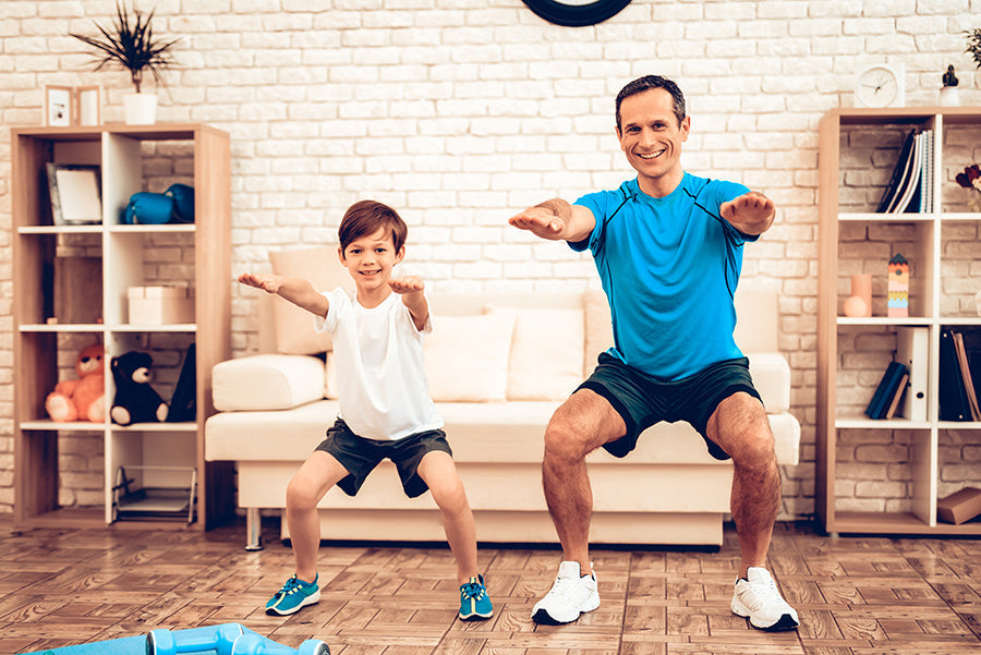 father and child working out in the swimming offseason